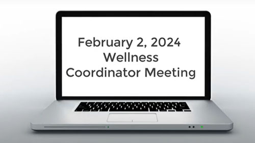 open laptop with text Feb. 2 Wellness Coordinator meeting on screen