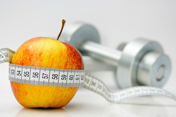 apple with weights and tape measure