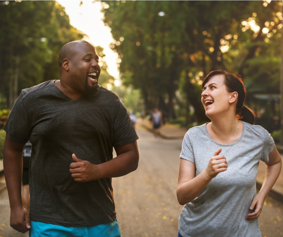 man and woman jogging outdoors